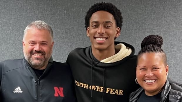 Dawson Merritt with his mother and Nebraska head coach Matt Rhule